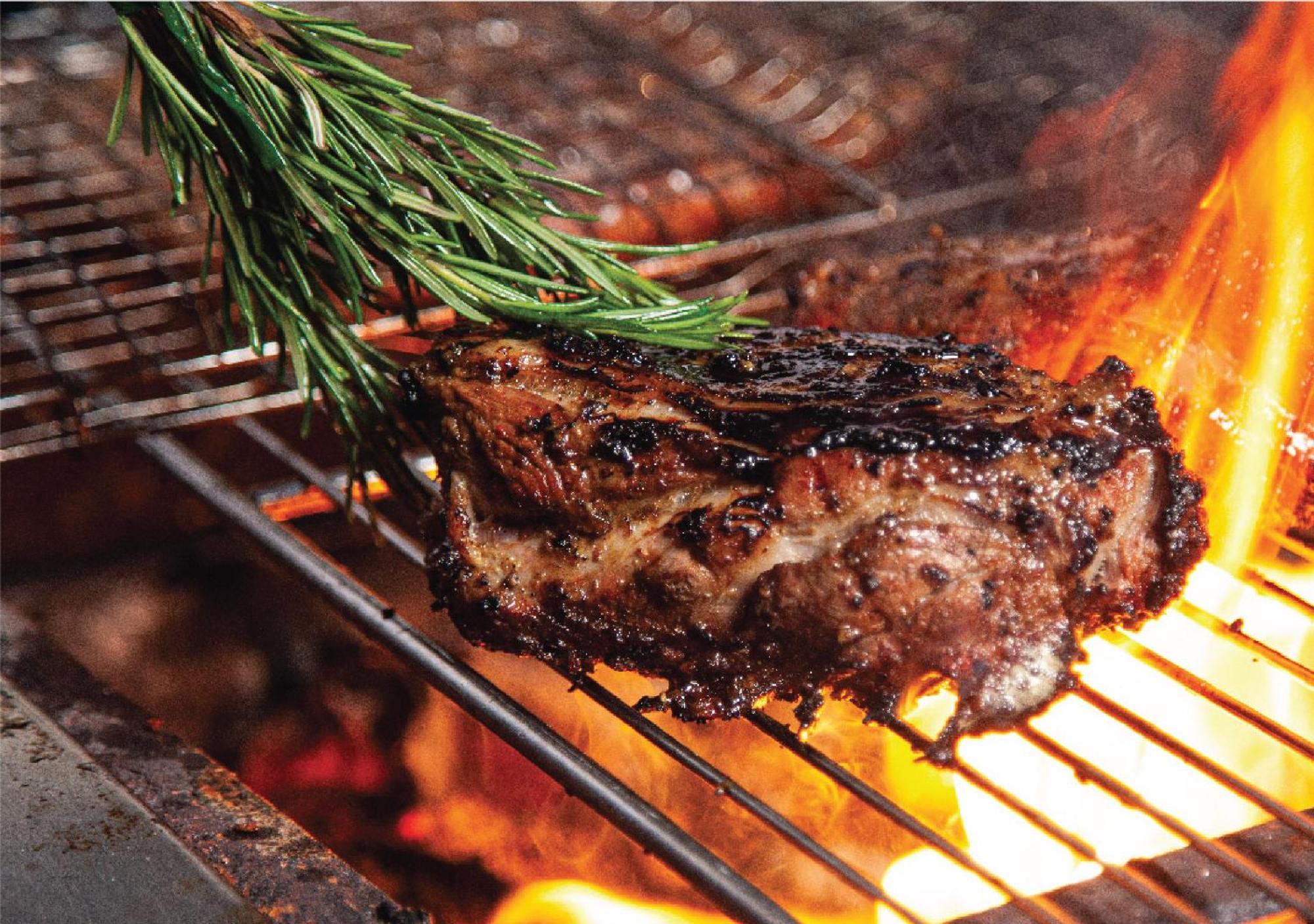 Jumeirah Messilah Beach Kuwait 쿠웨이트 외부 사진 A steak being grilled